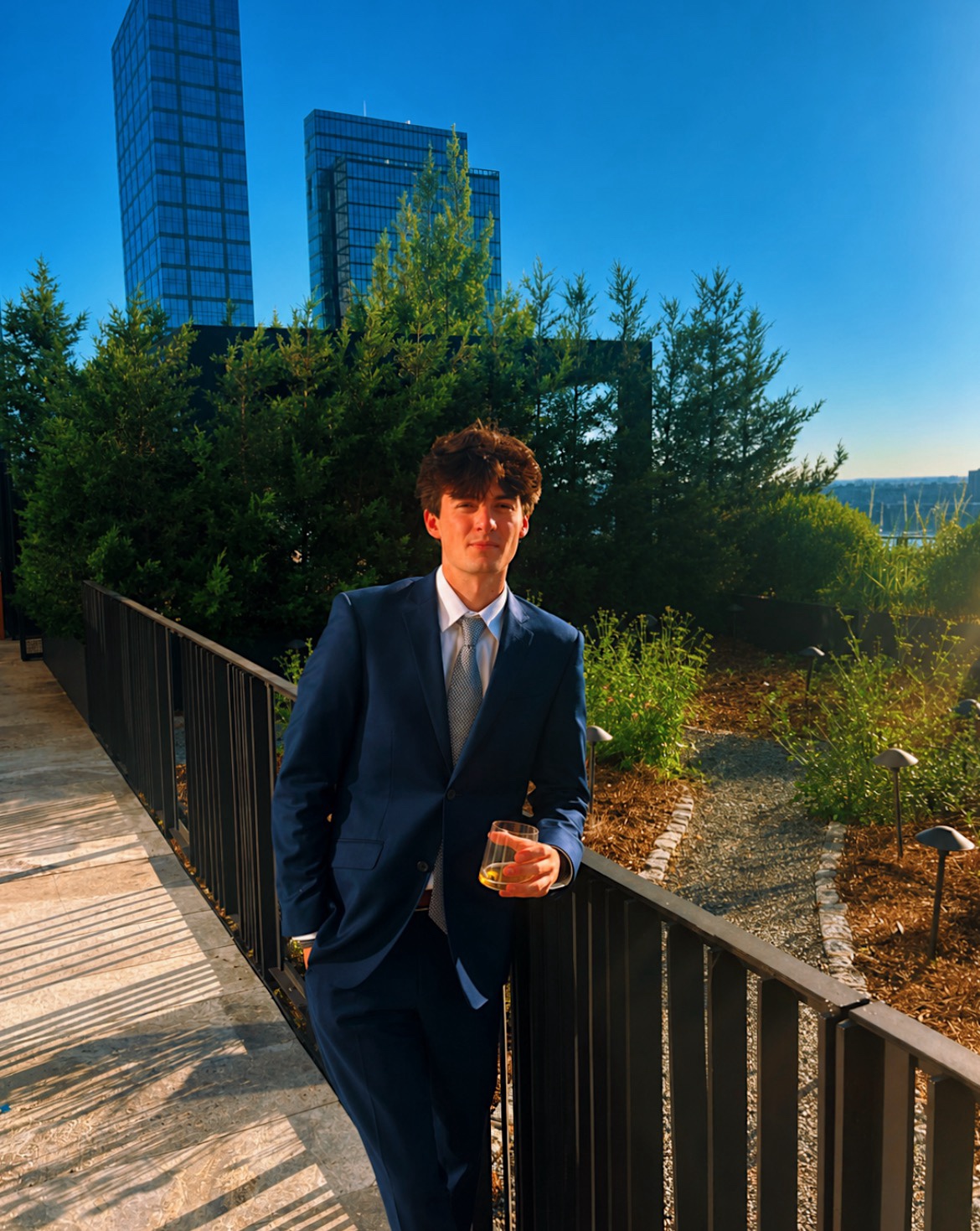 Owen Kennedy wearing a navy suit outdoors